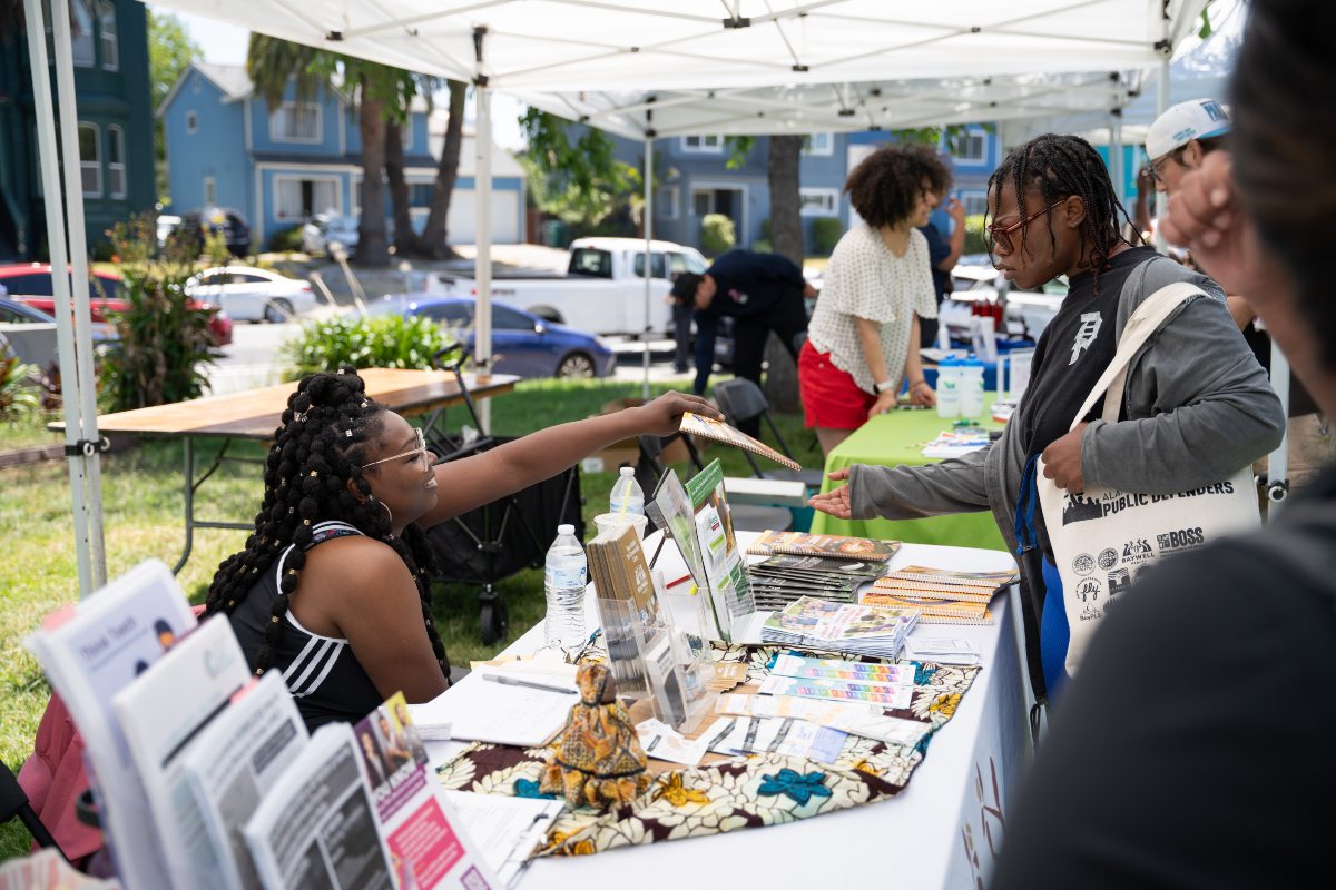 Person receiving information at Block Party booth