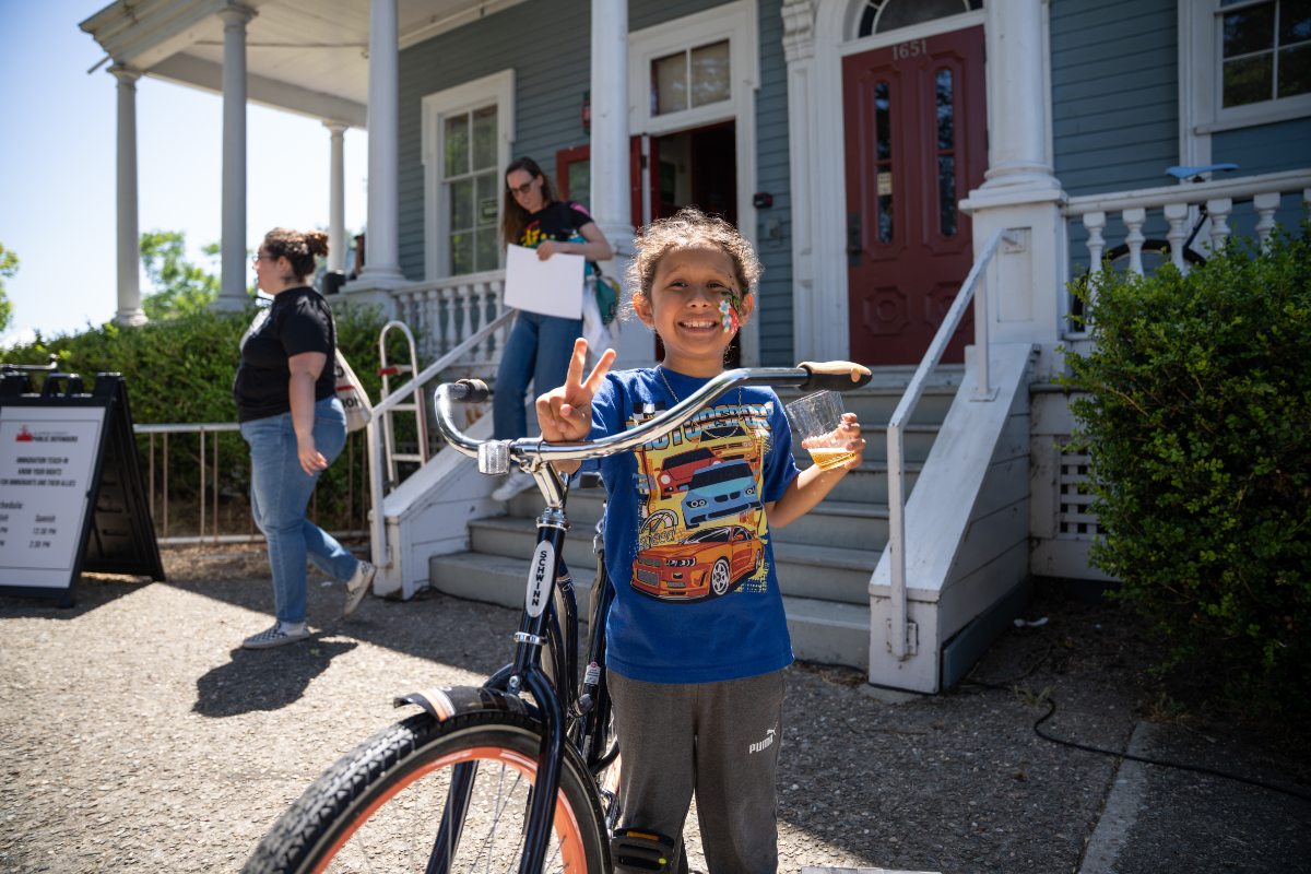 Kid with bike they just won in raffle